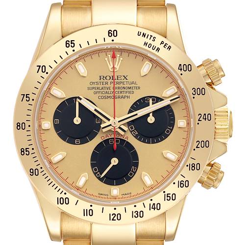 The image shows a frontal view of a Rolex Daytona 116528 Men's Yellow Gold Champagne Dial 116528 Men's Yellow Gold Champagne Dial, highlighting its gold bezel, subdials, and pushers.