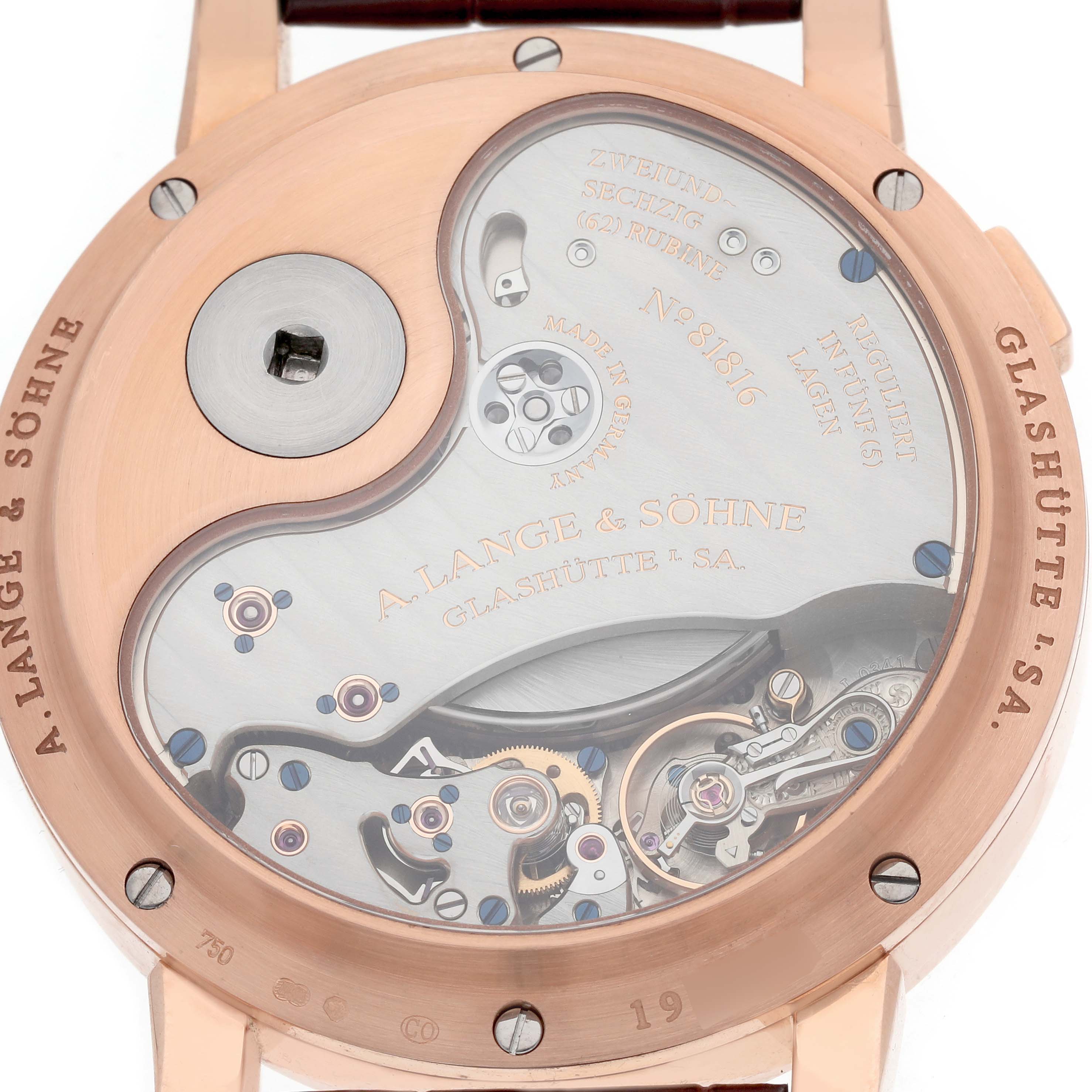 The image shows the back view of the A. Lange & Sohne Lange 1 130.032F Men's Rose Gold Silver Dial, highlighting its intricate movement and mechanical parts.