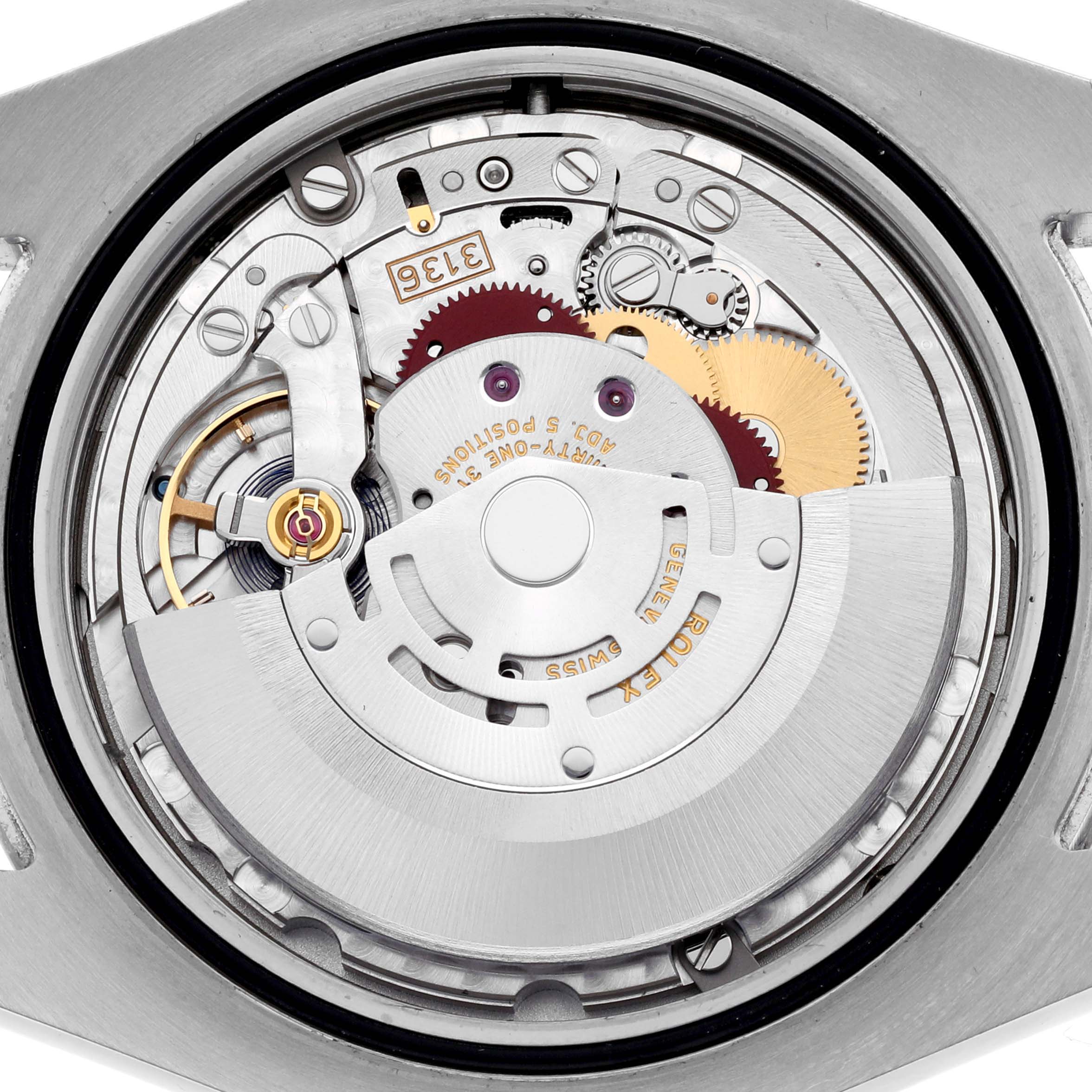 The image shows the internal movement of a Rolex Datejust 41 116300 Men's Stainless Steel Silver Dial 116300 Men's Stainless Steel Silver Dial watch, focusing on gears and the rotor from the back.