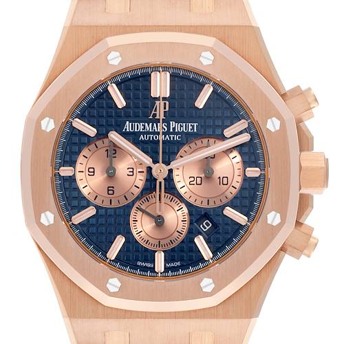 The image shows a front view of the Audemars Piguet Royal Oak 26331OR.OO.D315CR.01 Men's Rose Gold Blue Dial 26331OR.OO.D315CR.01 Men's Rose Gold Blue Dial watch, highlighting its dial, subdials, and crown.