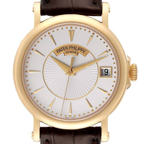 The image shows a frontal view of the Patek Philippe Calatrava 5153J-001 Men's Yellow Gold Silver Dial 5153J-001 Men's Yellow Gold Silver Dial watch, highlighting its face, hands, crown, and date window.