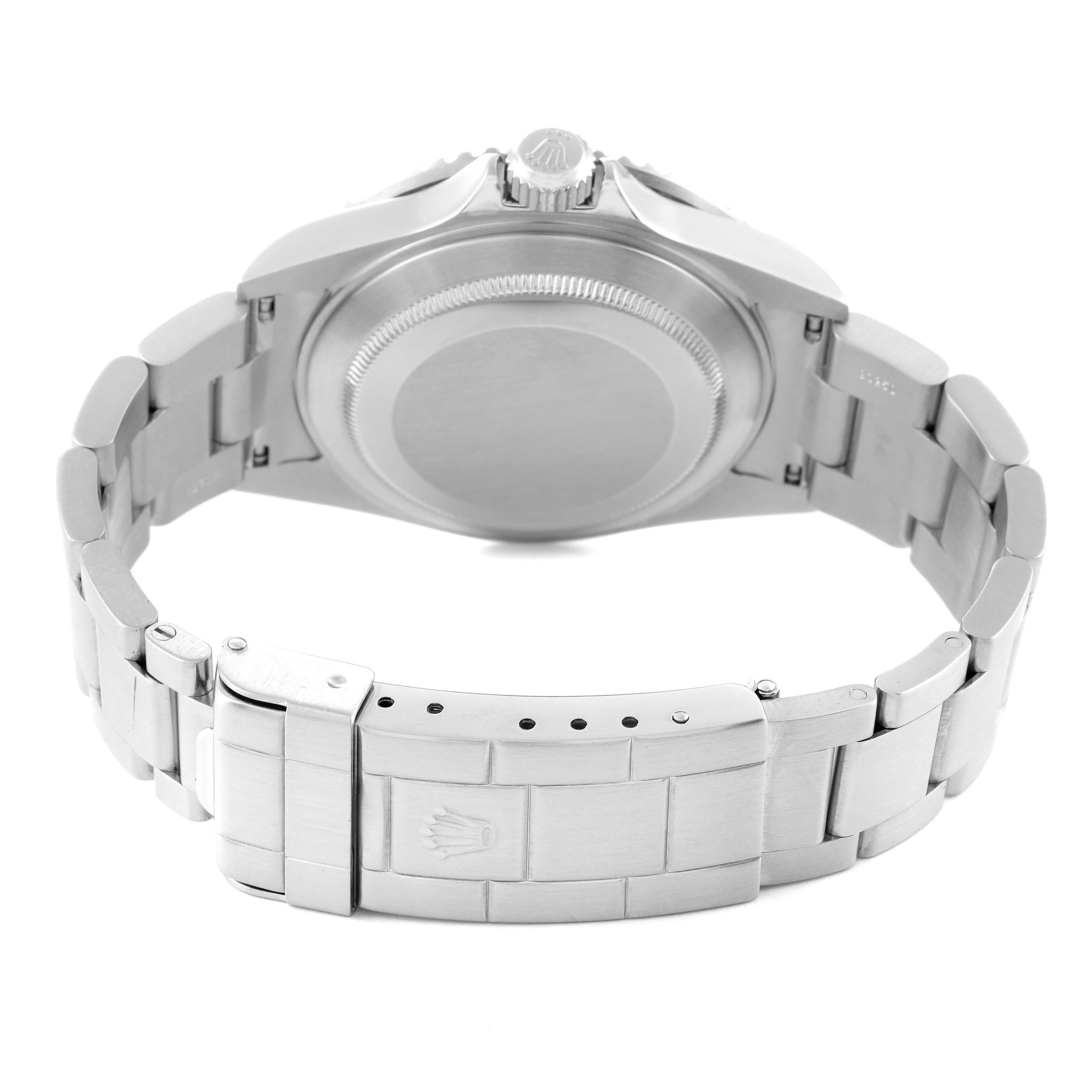 The image shows the back view of a Rolex Submariner 16610 Men's Stainless Steel Black Dial 16610 Men's Stainless Steel Black Dial, highlighting the case back, crown, and stainless steel bracelet with the clasp.