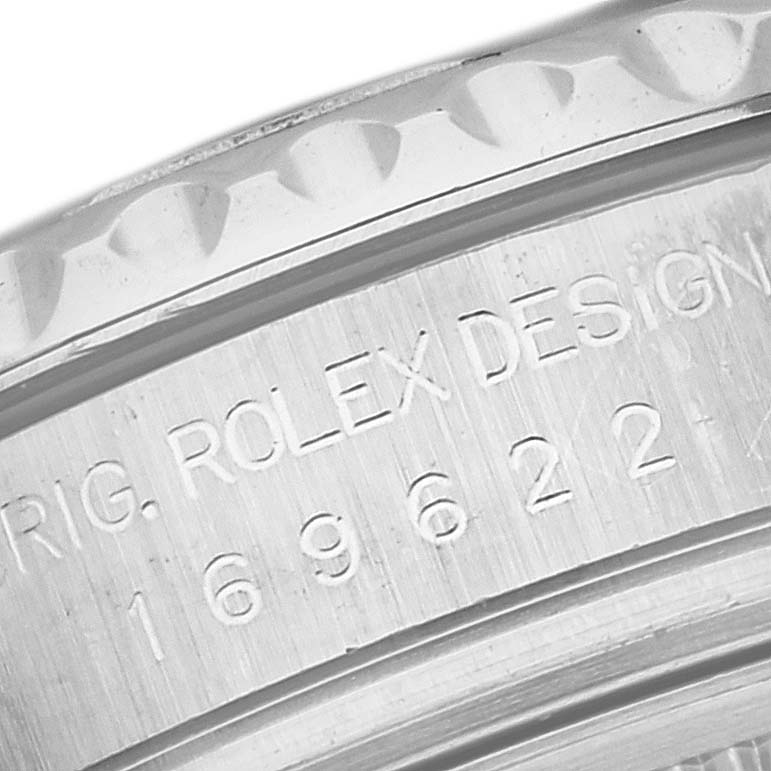 This close-up image shows the engraved side detail of the bezel on a Rolex Yacht-Master 169622 Women's Stainless Steel Silver Dial 169622 Women's Stainless Steel Silver Dial watch.