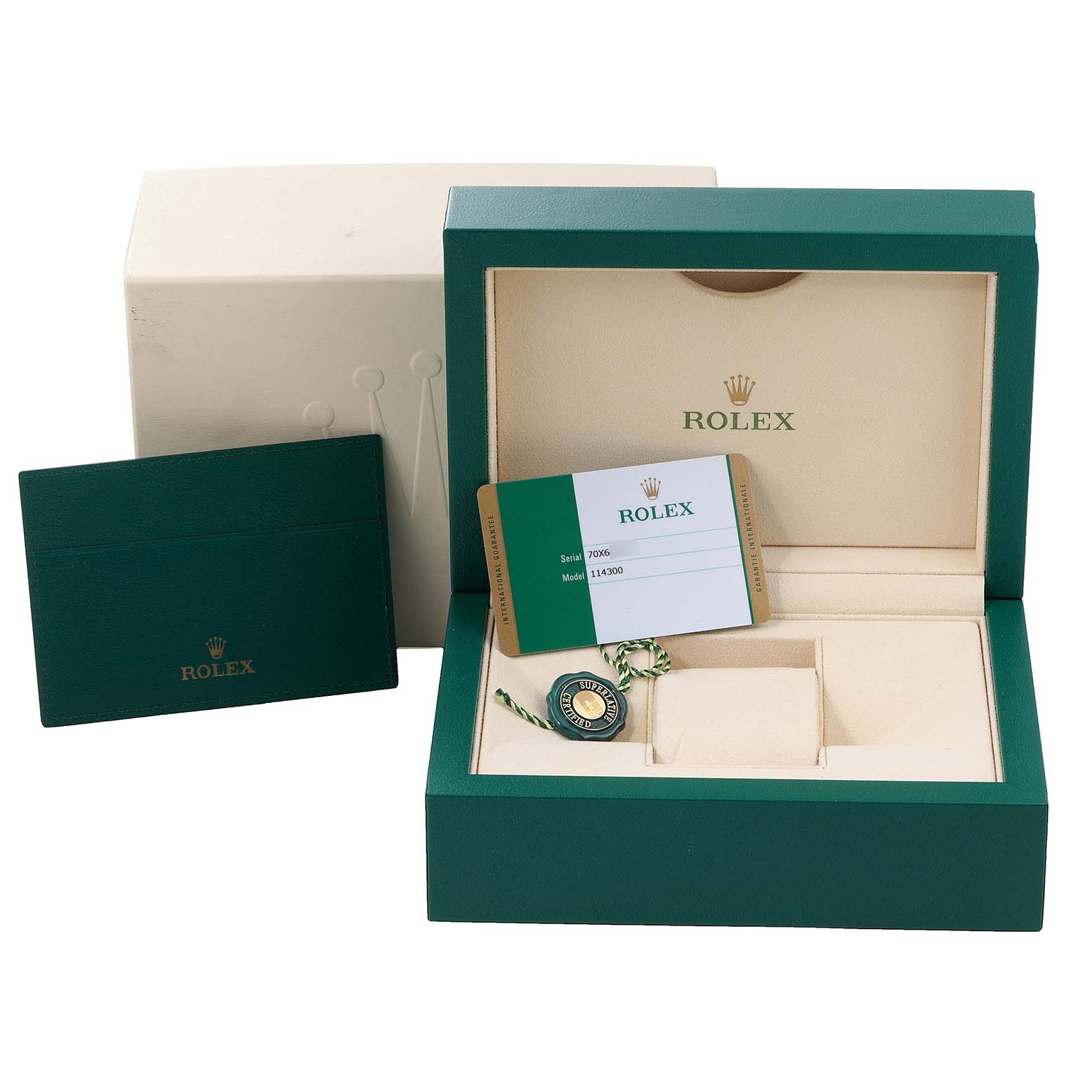 The image shows the packaging, box, and accessories (including tags and warranty card) of the Rolex Oyster Perpetual 114300 Men's Stainless Steel Burgundy Dial 114300 Men's Stainless Steel Burgundy Dial watch.