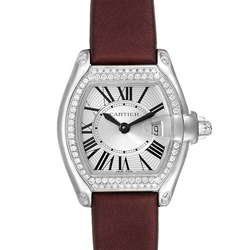 The image shows a Cartier Roadster WE500260 Women's White Gold Silver Dial WE500260 Women's White Gold Silver Dial watch, front view, featuring a silver dial, Roman numerals, date window, and a maroon strap.