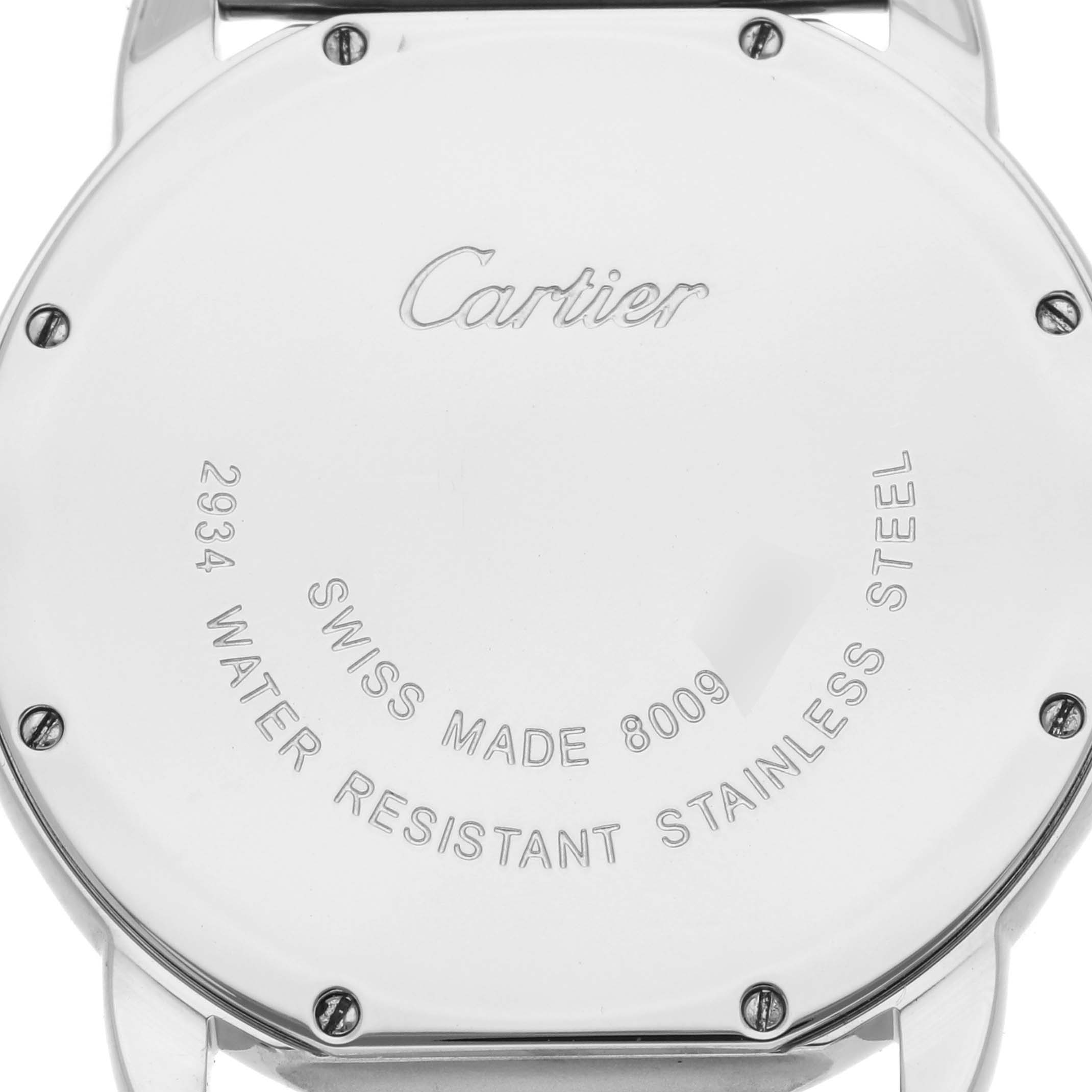The image shows the back case of a Cartier Ronde W6701005 Men's Stainless Steel Silver Dial W6701005 Men's Stainless Steel Silver Dial watch, displaying engraved text and screws.