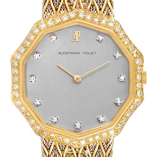 The image shows a frontal view of a Vintage Audemars Piguet watch with a diamond-studded bezel and gold mesh band.
