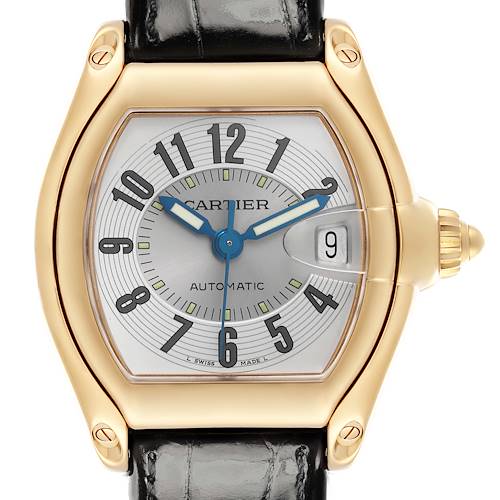 The Cartier Roadster W62003V2 Men's Yellow Gold Silver Dial W62003V2 Men's Yellow Gold Silver Dial watch is shown from a front angle, highlighting its face, gold casing, and black strap.
