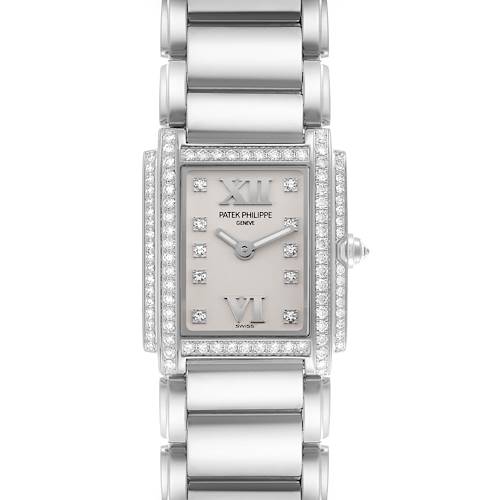 The Patek Philippe Twenty-4 4908/200G-011 Women's White Gold Silver Dial 4908/200G-011 Women's White Gold Silver Dial watch is shown from a top-down angle, highlighting the dial, bezel, and bracelet.