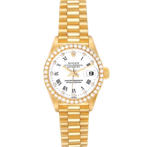 The Rolex President 79138 Women's Yellow Gold White Dial 79138 Women's Yellow Gold White Dial model watch is shown from a top-down angle, highlighting its gold bracelet, diamond-bezel, and white dial with Roman numerals.