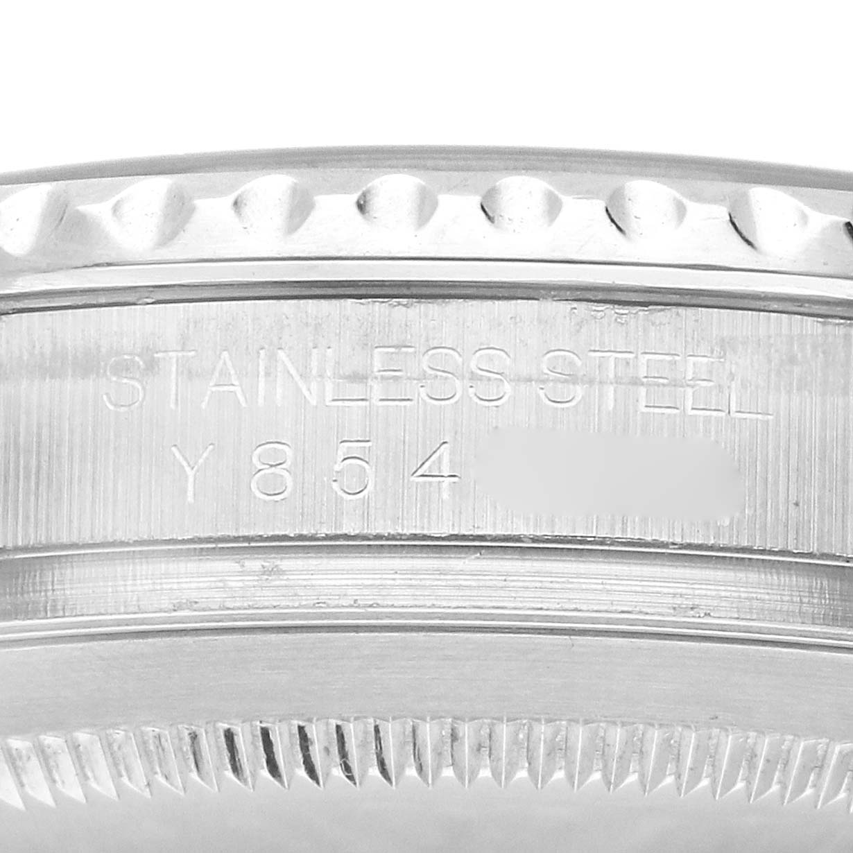 The image shows a close-up side view of the bezel and edge of the case of a Rolex Yacht-Master 16622 Men's Stainless Steel Silver Dial 16622 Men's Stainless Steel Silver Dial, highlighting the serial and material engraving.