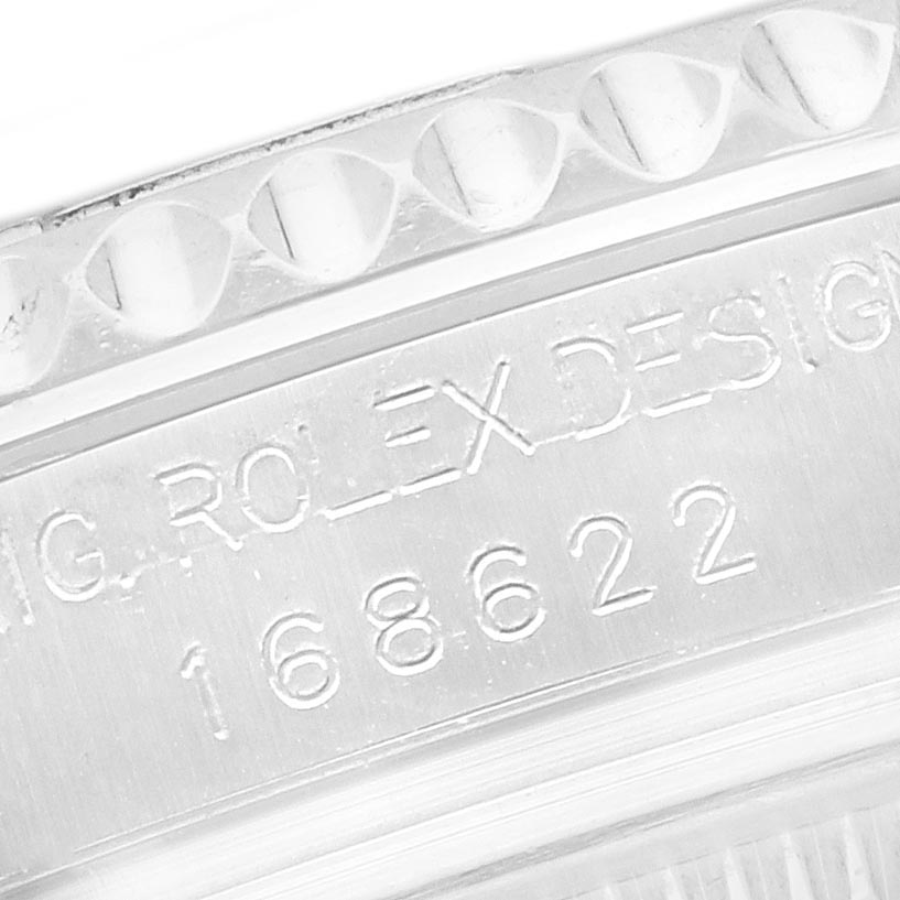 The image shows a close-up of the bezel and engraved serial number on the Rolex Yacht-Master 168622 Men's Stainless Steel Silver Dial 168622 Men's Stainless Steel Silver Dial watch.
