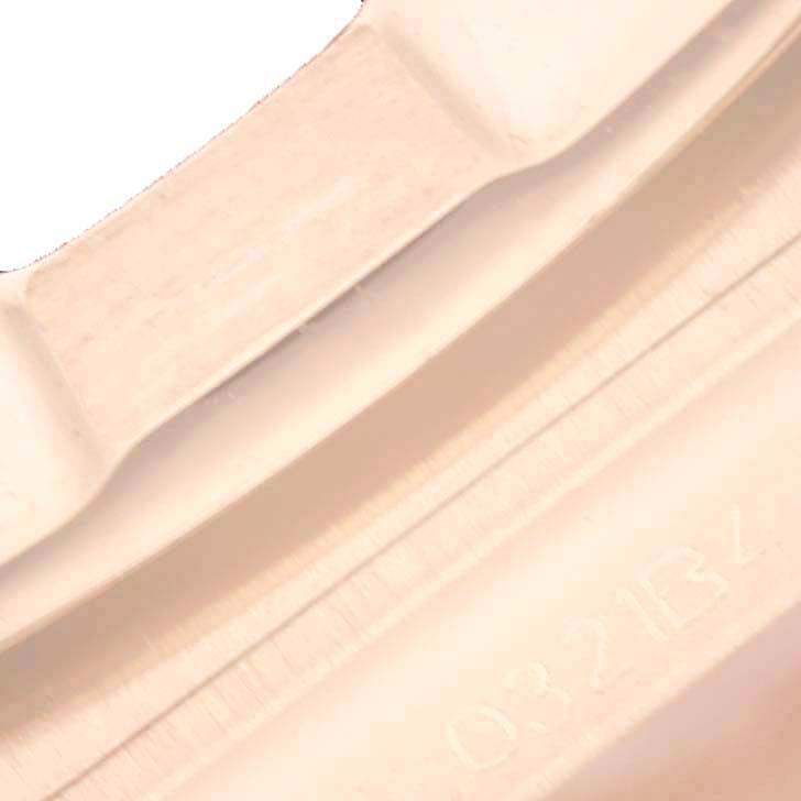 This image appears to show a close-up of the bezel and part of the case of the Breitling R77310101A1R1 Women's Rose Gold White Dial R77310101A1R1 Women's Rose Gold White Dial Chronomat 32 White Dial Rose Gold Ladies Watch R77310.