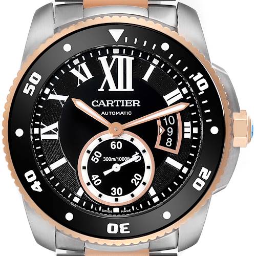 The image shows a close-up view of the Calibre de Cartier watch by Cartier, highlighting the dial, bezel, and hands.