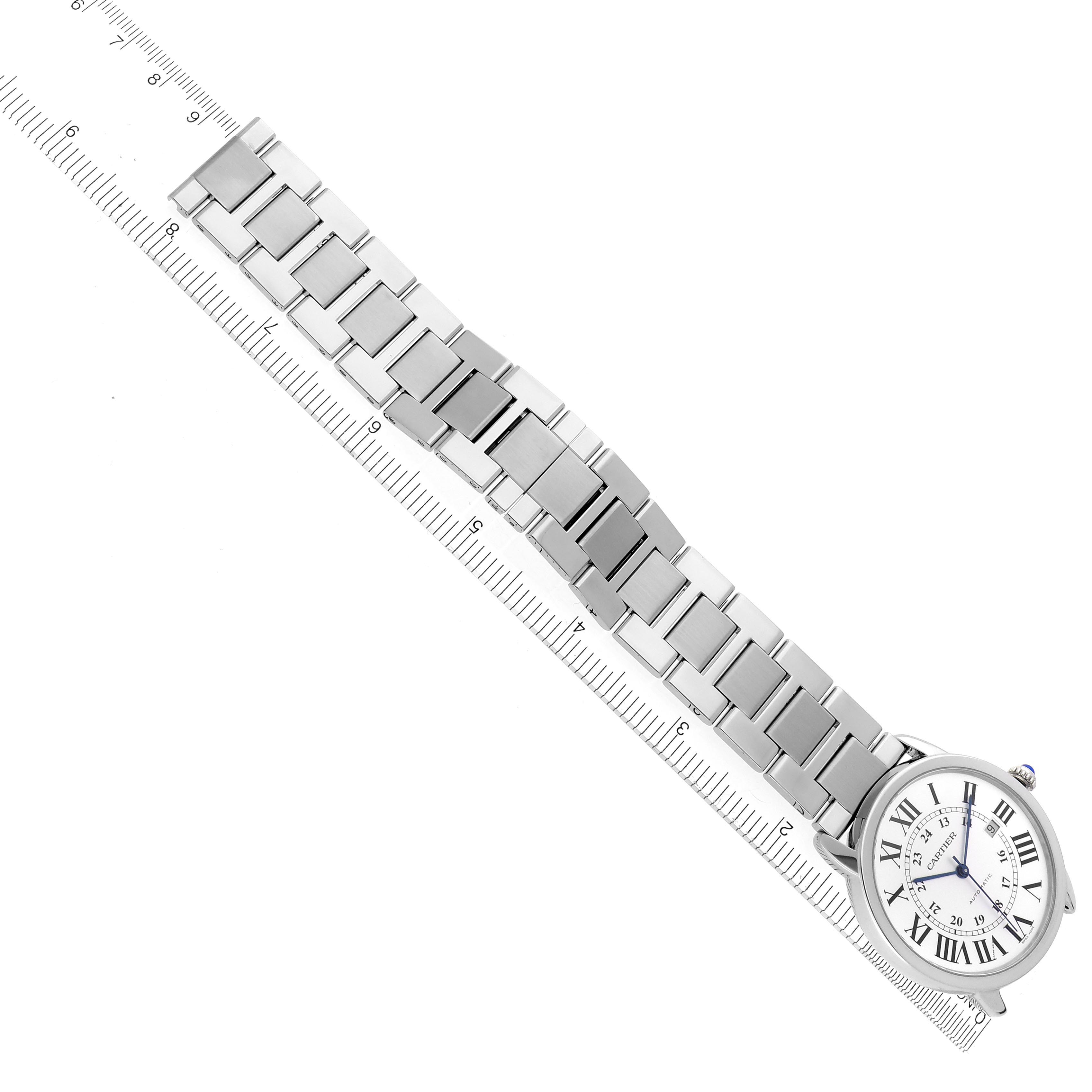 The Cartier Ronde W6701011 Men's Stainless Steel Silver Dial W6701011 Men's Stainless Steel Silver Dial watch is shown at an angle, highlighting its face and metal bracelet, aligned with a ruler for scale.