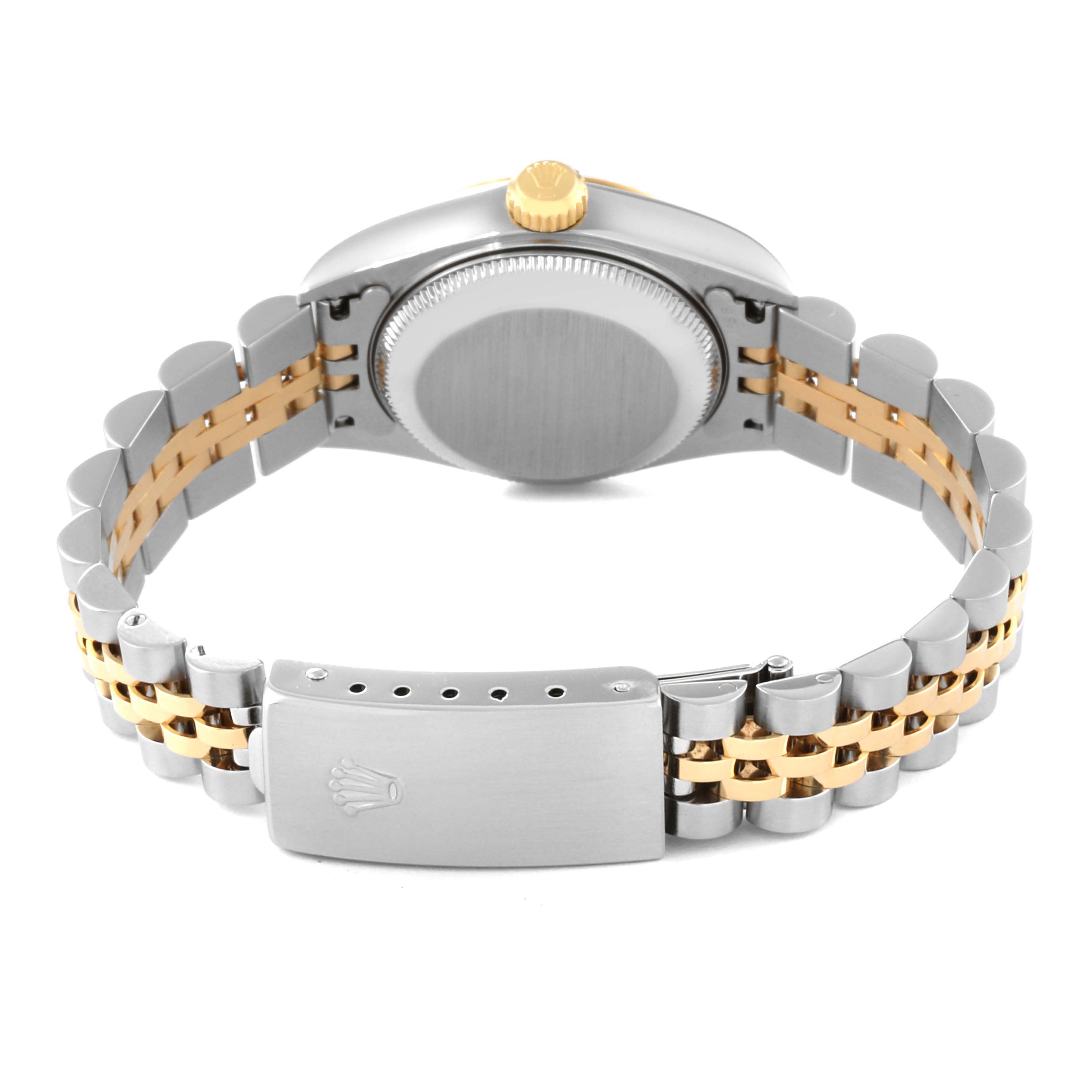 This image shows the back case, crown, and two-tone bracelet of the Rolex Datejust 79173 Women's Steel and Gold (two tone) Beige Dial 79173 Women's Steel and Gold (two tone) Beige Dial watch.