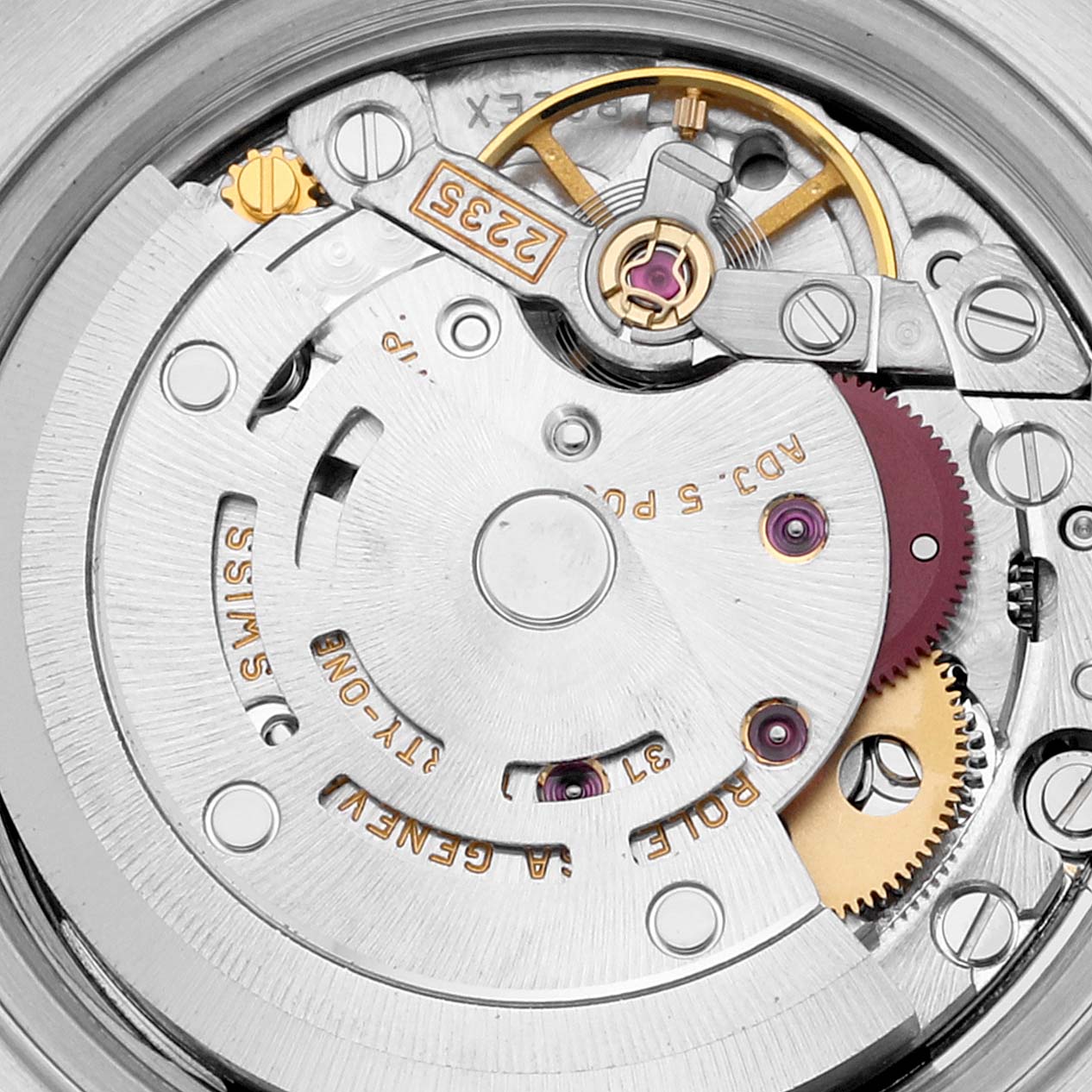 The image shows the intricate internal mechanism of a Rolex Datejust 79173 Women's Steel and Gold (two tone) Beige Dial 79173 Women's Steel and Gold (two tone) Beige Dial watch, highlighting gears and components from a top-down angle.
