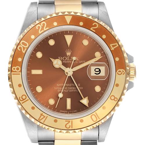 The Rolex GMT-Master 16713 Men's Steel and Gold (two tone) Brown Dial 16713 Men's Steel and Gold (two tone) Brown Dial watch is shown from the front, displaying its brown dial and gold bezel, with the crown partially visible.
