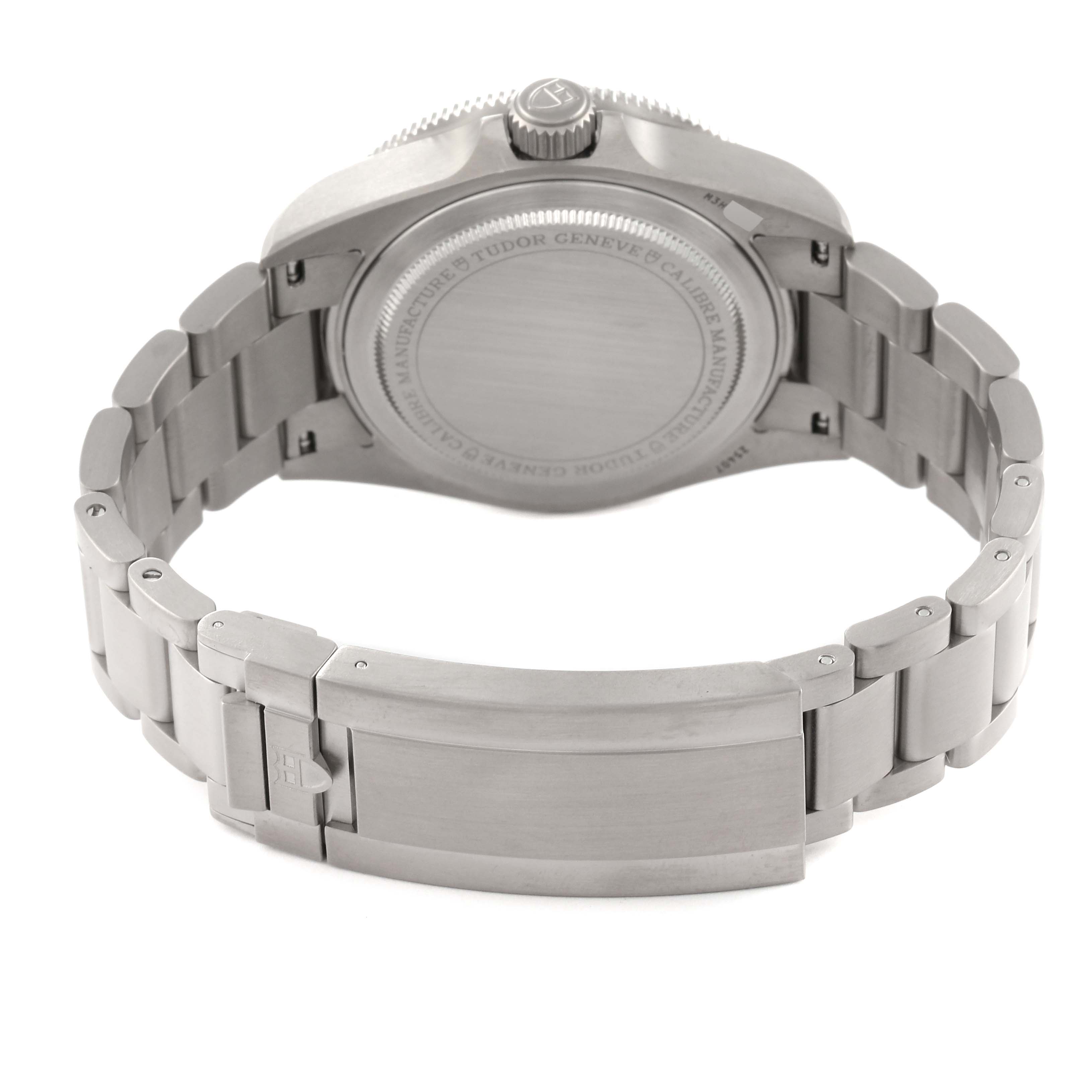 The image shows the back view of the Tudor Pelagos 25407N-0001 Men's Titanium Black Dial 25407N-0001 Men's Titanium Black Dial watch, including the case back and bracelet with a deployment clasp.