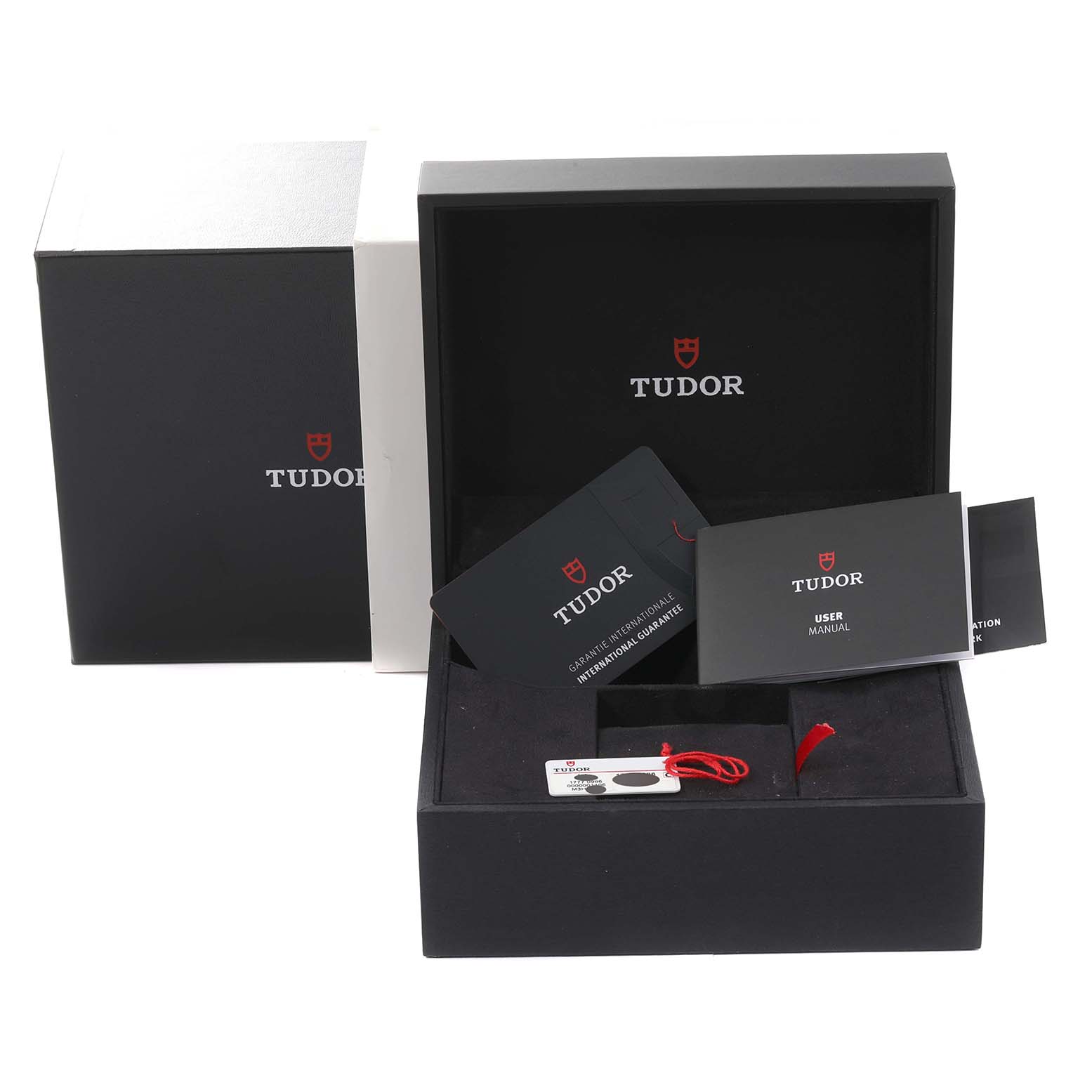This image shows the packaging, manuals, warranty card, and accessories for a Tudor Pelagos 25407N-0001 Men's Titanium Black Dial 25407N-0001 Men's Titanium Black Dial watch.