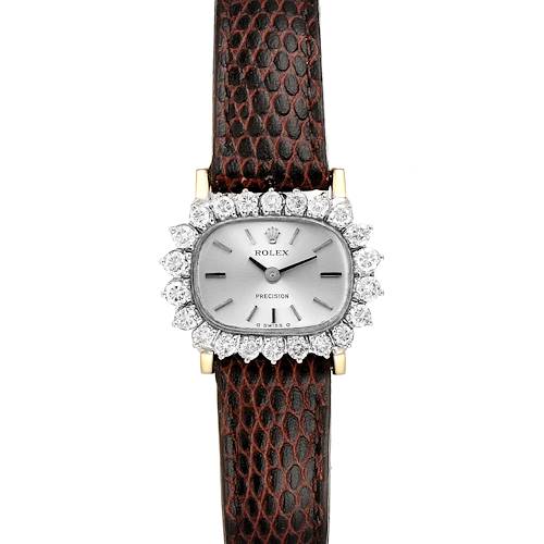 The Rolex Cocktail  Women's White Gold Silver Dial  Women's White Gold Silver Dial model is shown from a top-down angle, displaying its face, bezel, hands, and brown textured strap.