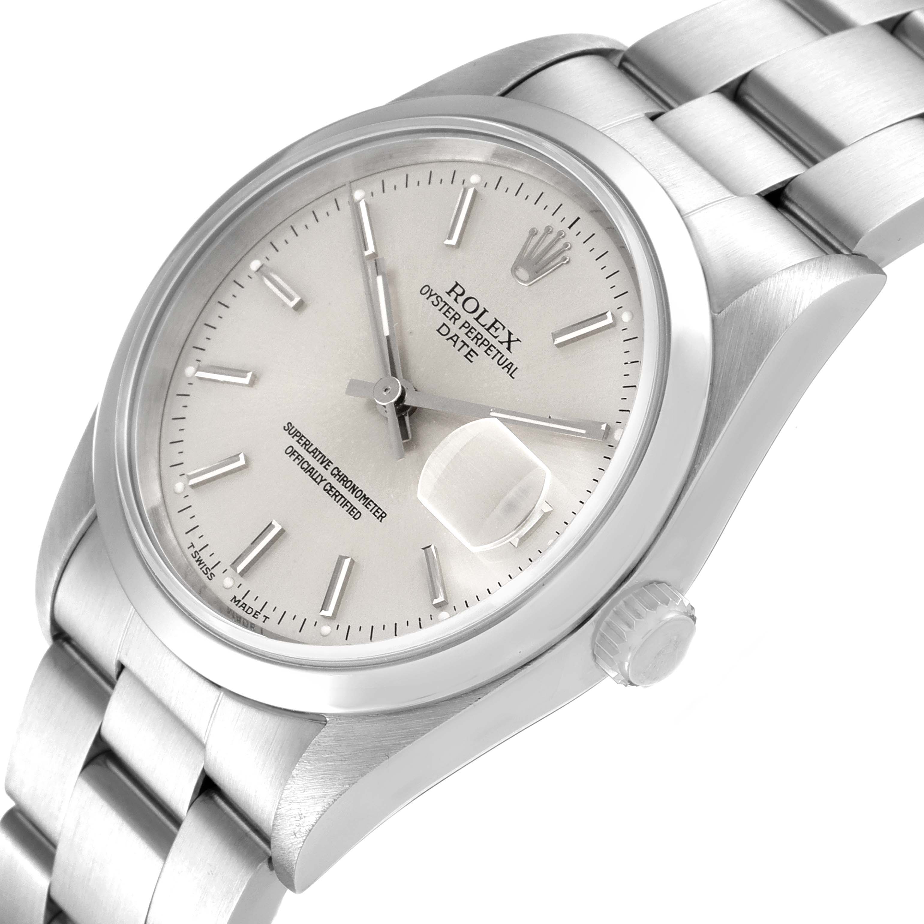 This image shows a Rolex Oyster Perpetual Date watch from a slight top-side angle, highlighting the dial, bracelet, and crown.