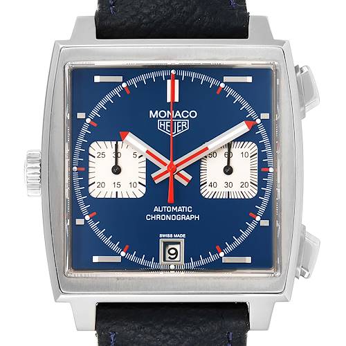 The Tag Heuer Monaco watch is shown from a front angle, displaying its blue dial, subdials, date window, and black leather strap.