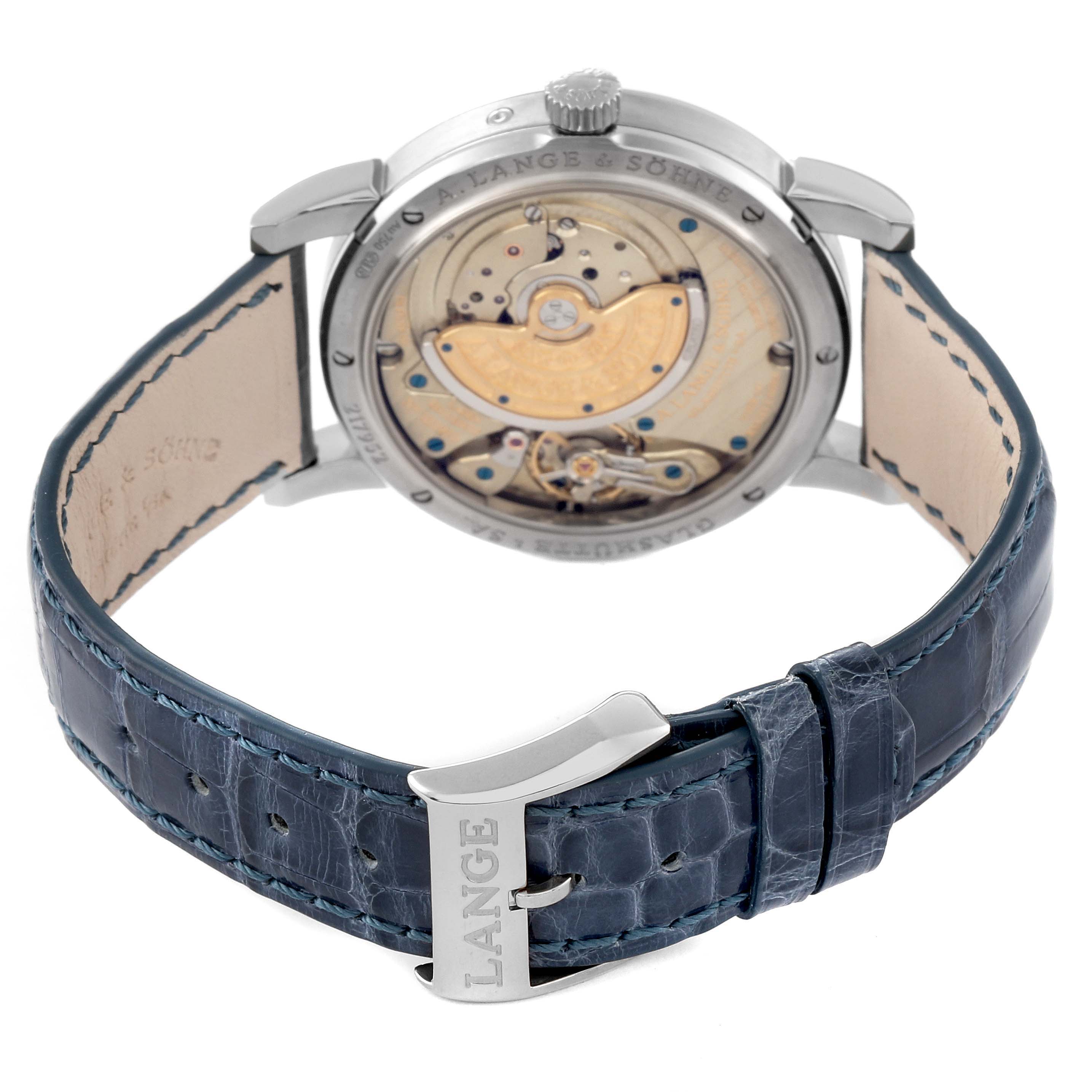 This image shows the back view of the A. Lange & Sohne Saxonia 330.026 Men's White Gold Silver Dial watch, highlighting its movement and blue leather strap.