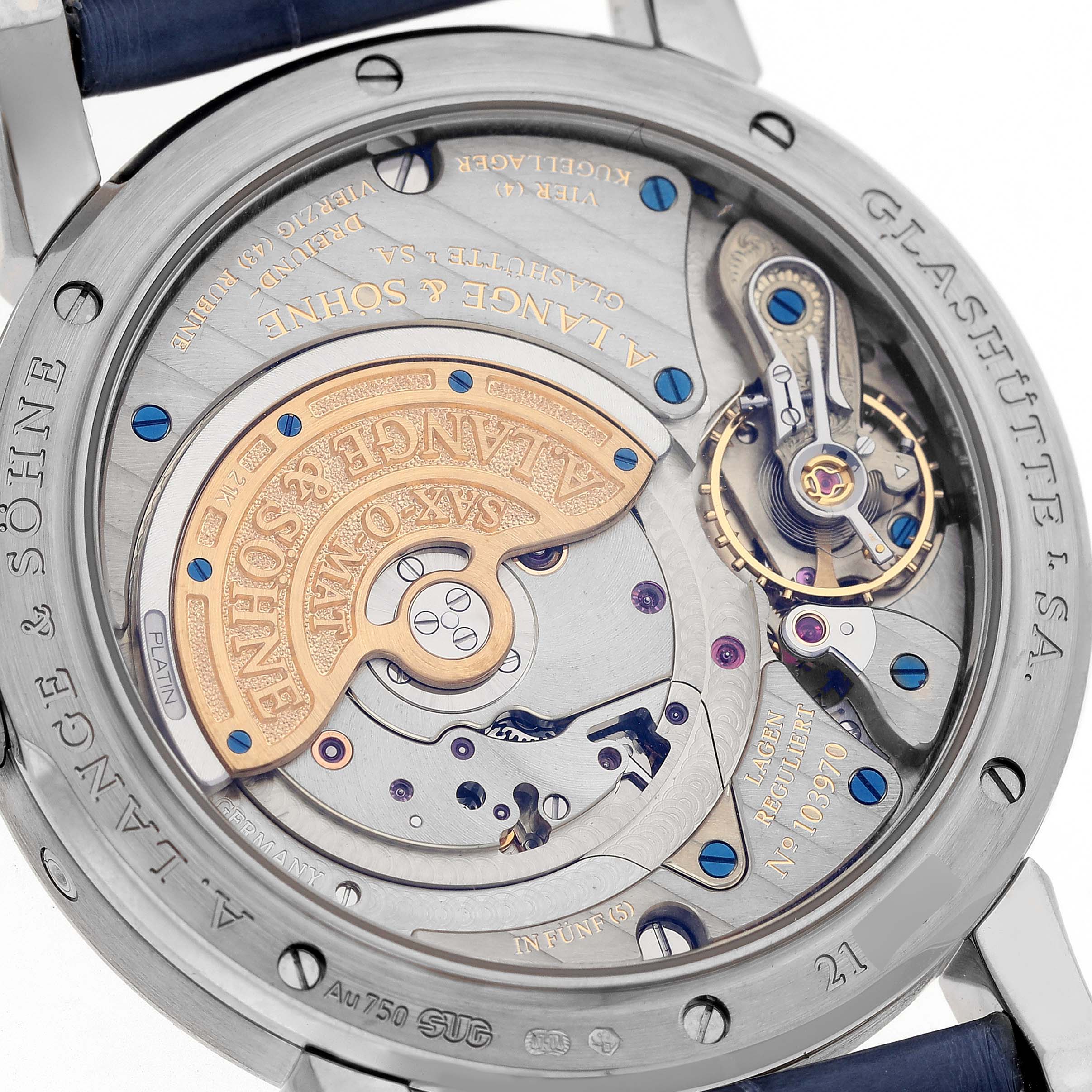 The image shows the back view of the A. Lange & Sohne Saxonia 330.026 Men's White Gold Silver Dial watch, highlighting the intricate movement and components.