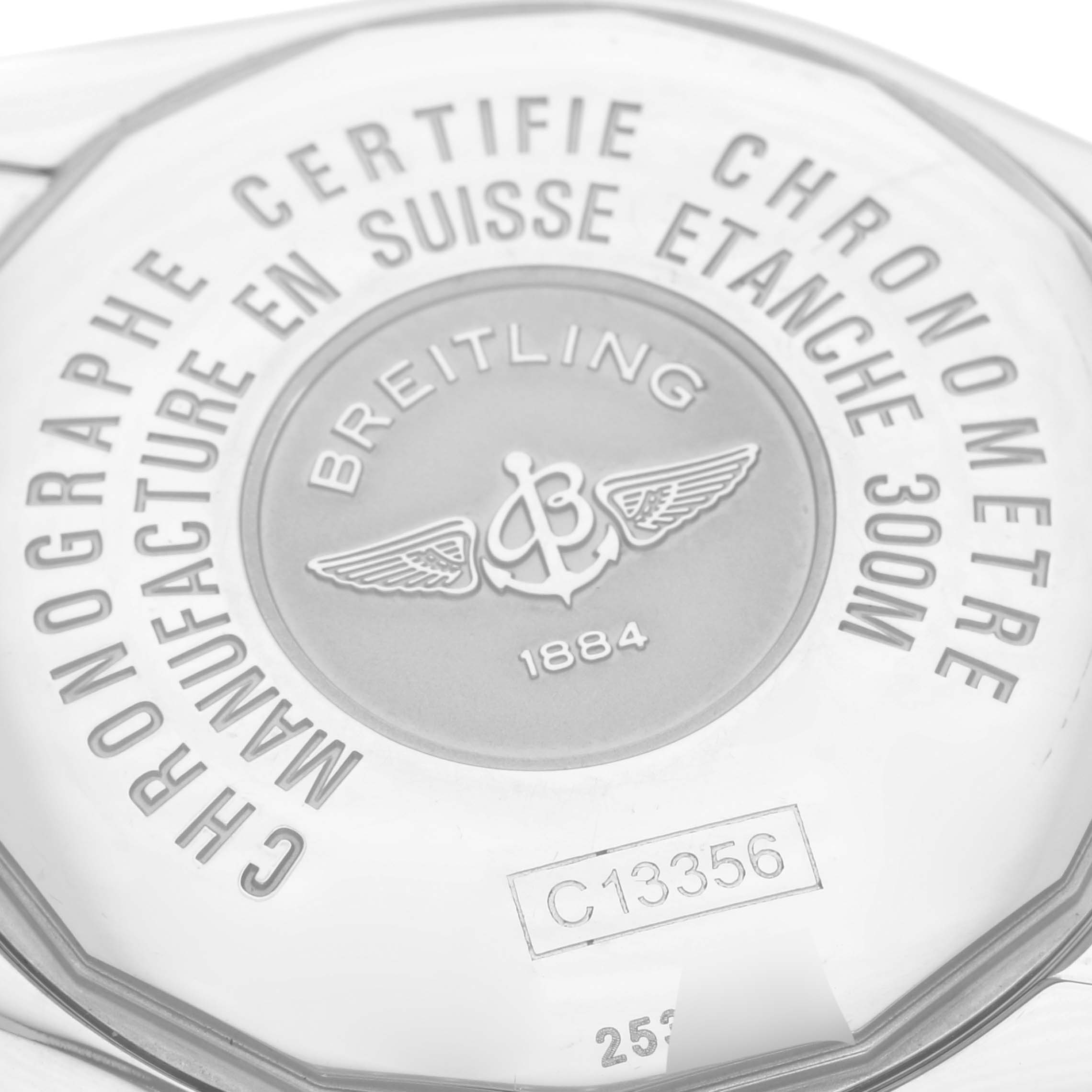 The image shows the back case of a Breitling Chronomat C156A19PAC Men's Steel and Gold (two tone) Silver Dial C156A19PAC Men's Steel and Gold (two tone) Silver Dial watch, highlighting engravings and branding details.