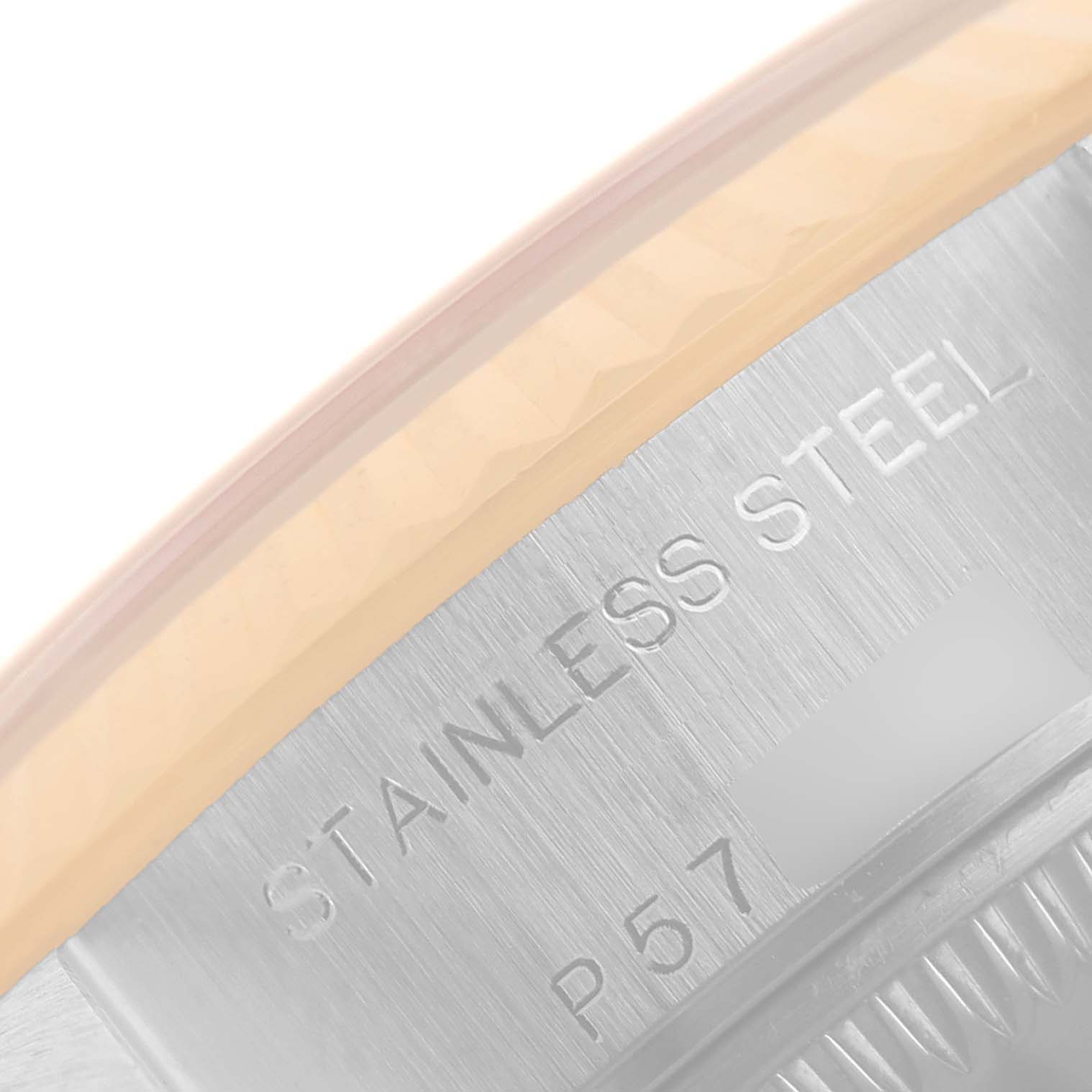 This image shows a close-up angle of the case back edge of a Rolex Datejust 79173 Women's Steel and Gold (two tone) White Dial 79173 Women's Steel and Gold (two tone) White Dial watch, highlighting the "Stainless Steel" engraving.