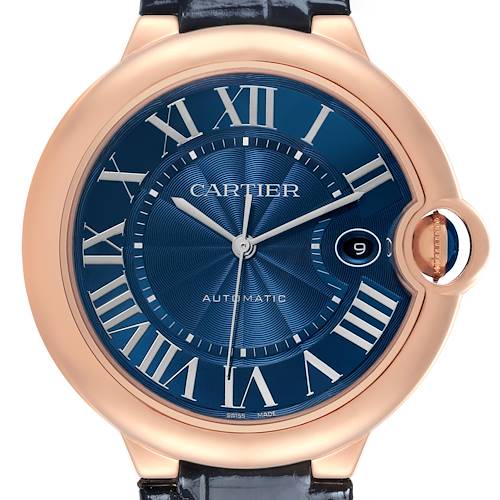 The image shows a Ballon Bleu de Cartier watch from a front angle, highlighting its blue dial, Roman numerals, and crown at three o'clock.