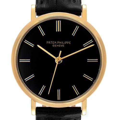 The image shows a frontal view of the Patek Philippe Calatrava 3569 Men's Yellow Gold Black Dial 3569 Men's Yellow Gold Black Dial watch, highlighting the black dial, gold case, and leather strap.