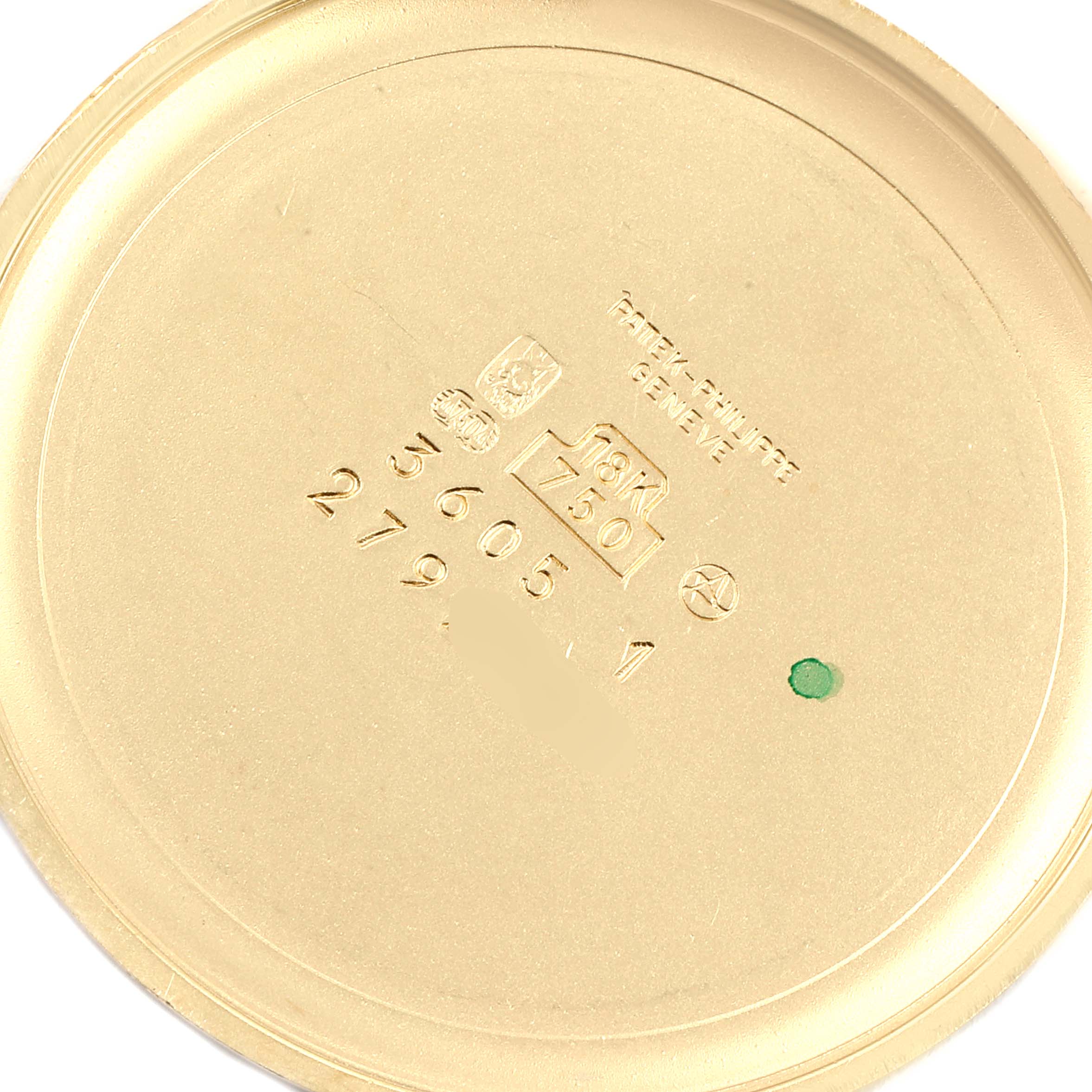 This image shows the inner case back of a Patek Philippe Golden Ellipse 3605 Men's Yellow Gold Champagne Dial 3605 Men's Yellow Gold Champagne Dial watch, featuring engravings and hallmarks.