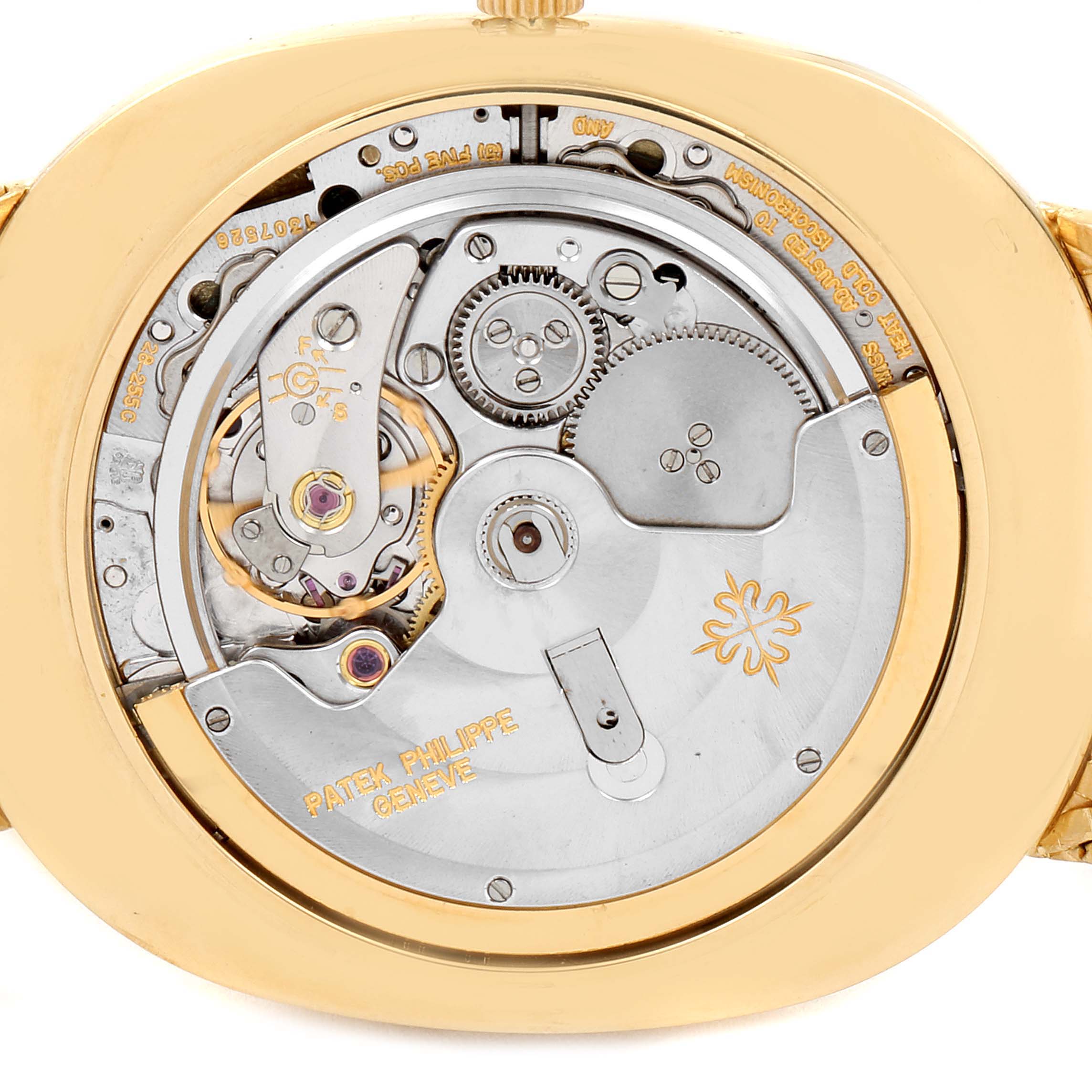 The image shows the back view of the Patek Philippe Golden Ellipse 3605 Men's Yellow Gold Champagne Dial 3605 Men's Yellow Gold Champagne Dial watch, highlighting its intricate mechanical movement.