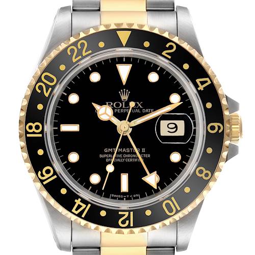 The Rolex GMT-Master 16713LN Men's Steel and Gold (two tone) Black Dial 16713LN Men's Steel and Gold (two tone) Black Dial watch is shown from a front angle, highlighting the dial, bezel, and part of the bracelet.