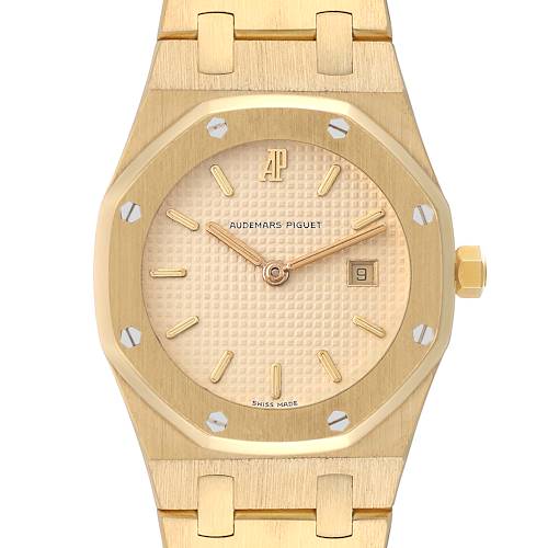 This is a close-up view of an Audemars Piguet Royal Oak Women's Yellow Gold Beige Dial Women's Yellow Gold Beige Dial watch showing the dial, hands, bezel, crown, and part of the bracelet.