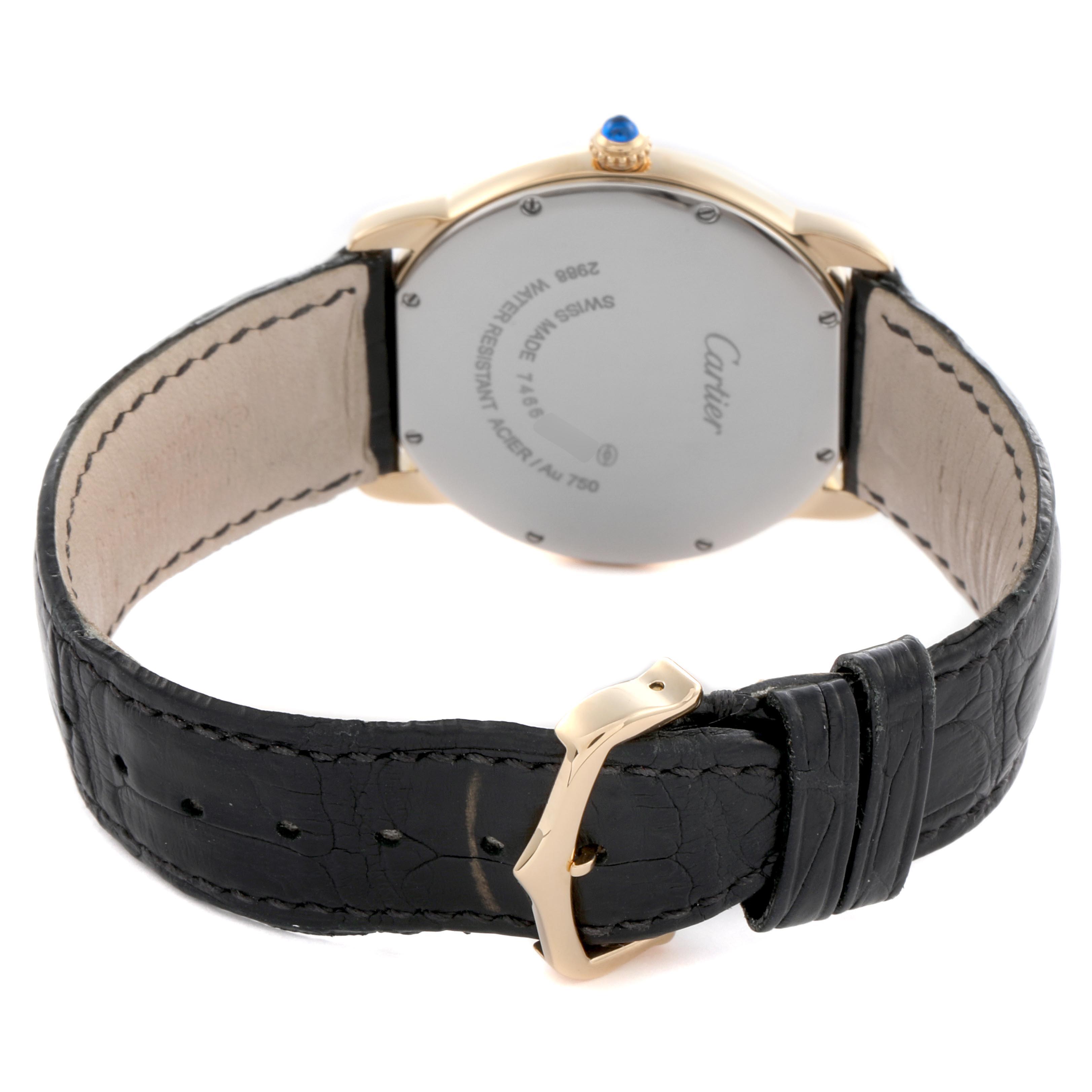 The image shows the back of a Cartier Ronde W6700455 Men's Yellow Gold Silver Dial W6700455 Men's Yellow Gold Silver Dial watch, featuring its case, crown, and black leather strap with a buckle.