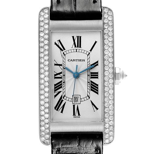 The Cartier Tank Americaine WB702651 Women's White Gold Silver Dial WB702651 Women's White Gold Silver Dial watch is shown front-facing, highlighting the dial, Roman numerals, blue hands, and diamond-set bezel.