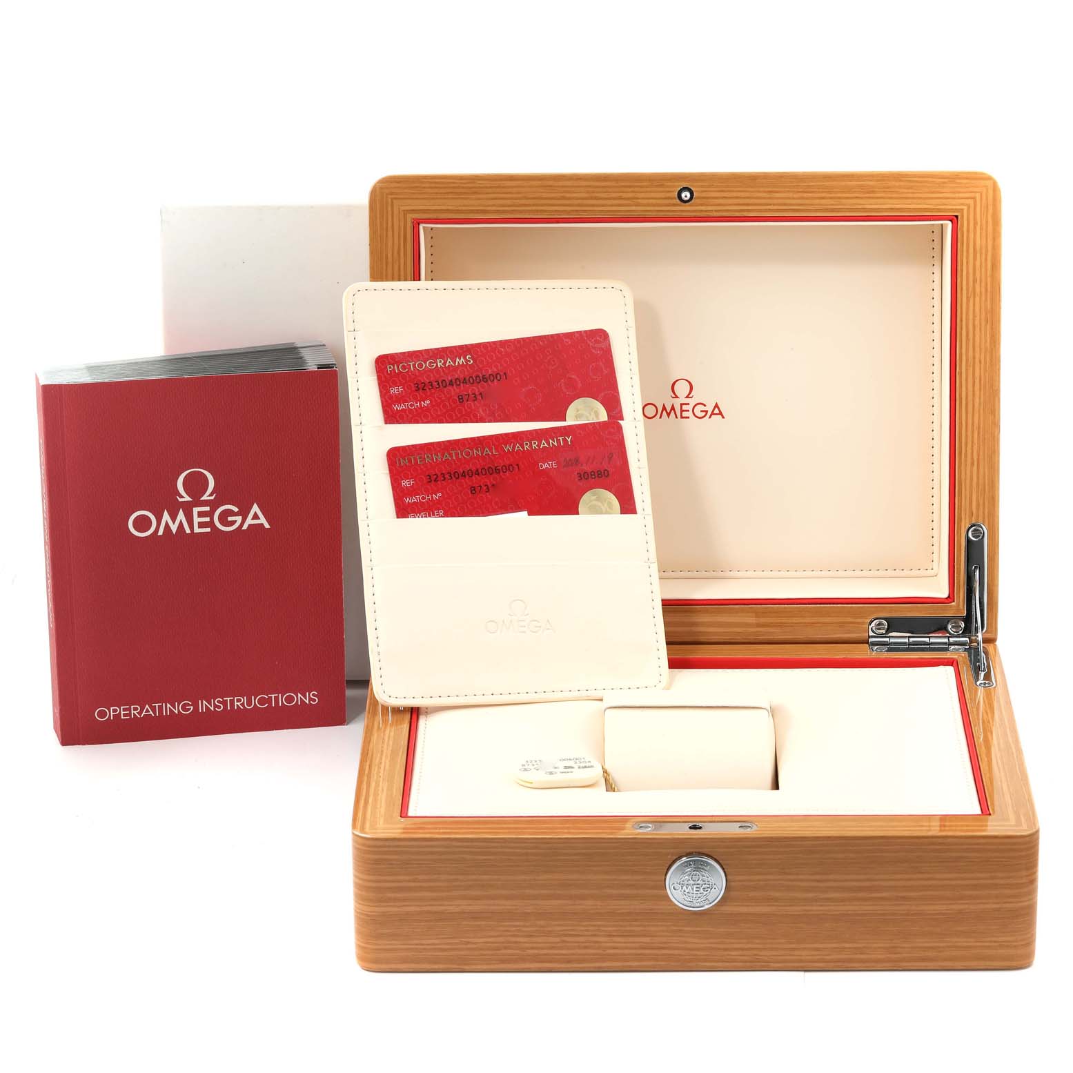 The image shows an open Omega Speedmaster 323.30.40.40.06.001 Men's Stainless Steel Grey Dial 323.30.40.40.06.001 Men's Stainless Steel Grey Dial watch box with warranty cards, a manual, and the inner compartments.