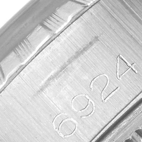 The image shows a close-up of the inner case back of a Rolex Date 6924 Women's Stainless Steel Silver Dial 6924 Women's Stainless Steel Silver Dial model, highlighting engraved numbers.