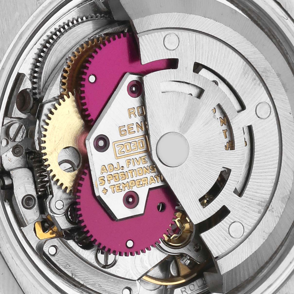The image shows the movement of a Rolex Date 6924 Women's Stainless Steel Silver Dial 6924 Women's Stainless Steel Silver Dial watch, focusing on the gears and rotor at an overhead angle.