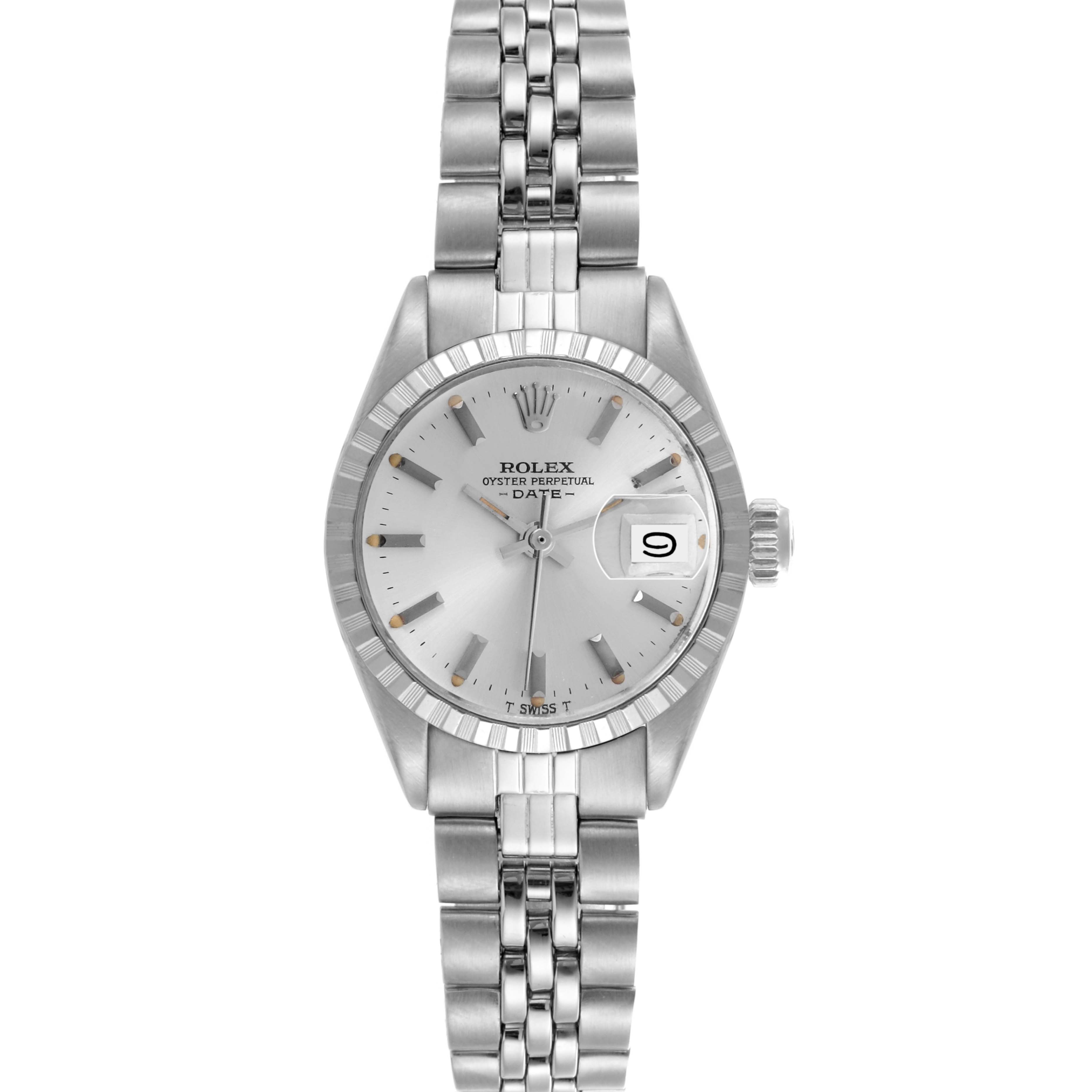 The Rolex Date 6924 Women's Stainless Steel Silver Dial 6924 Women's Stainless Steel Silver Dial watch is shown from a top-down angle, highlighting its dial, bezel, and metal bracelet.