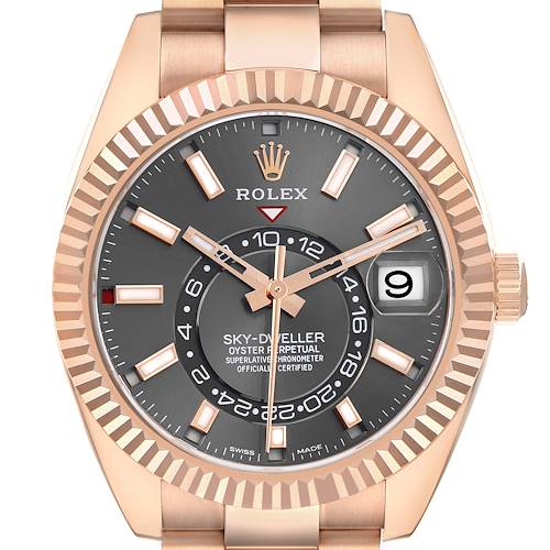 The Rolex Sky-Dweller M326935-0004 Men's Rose Gold Grey Dial M326935-0004 Men's Rose Gold Grey Dial watch is shown from a front angle, displaying the face, bezel, hands, crown, and part of the bracelet.