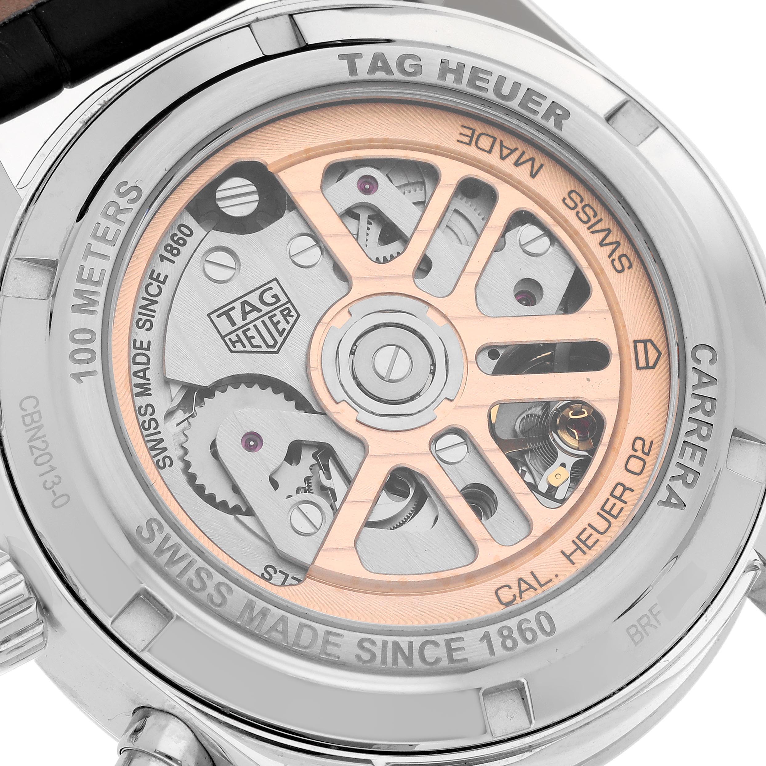 The image shows the back view of a Tag Heuer Carrera CBN2013-0 Men's Stainless Steel Silver Dial CBN2013-0 Men's Stainless Steel Silver Dial watch, focusing on its exposed movement and engravings.