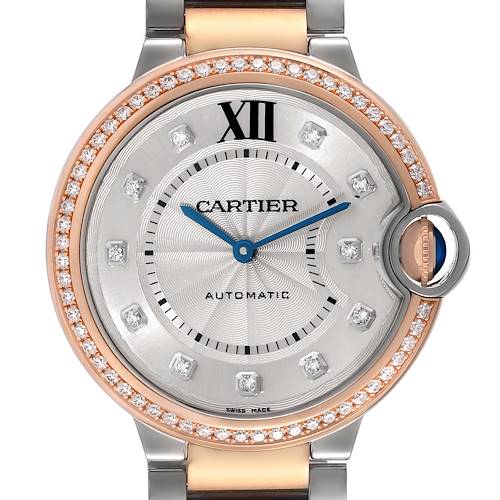 The image shows a close-up front view of the Cartier Ballon Bleu W3BB0004 Women's Steel and Gold (two tone) Silver Dial W3BB0004 Women's Steel and Gold (two tone) Silver Dial watch, highlighting its face, hands, dial, and the crown with a blue sapphire.