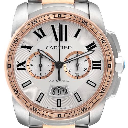 The Calibre de Cartier watch is shown from a front angle, displaying its face, subdials, hands, and the crown.