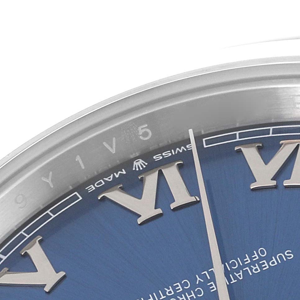 The image shows a close-up angle of the dial and part of the bezel of a Rolex Datejust 41 126300 Men's Stainless Steel Blue Dial 126300 Men's Stainless Steel Blue Dial watch, highlighting Roman numerals and the minute markers.