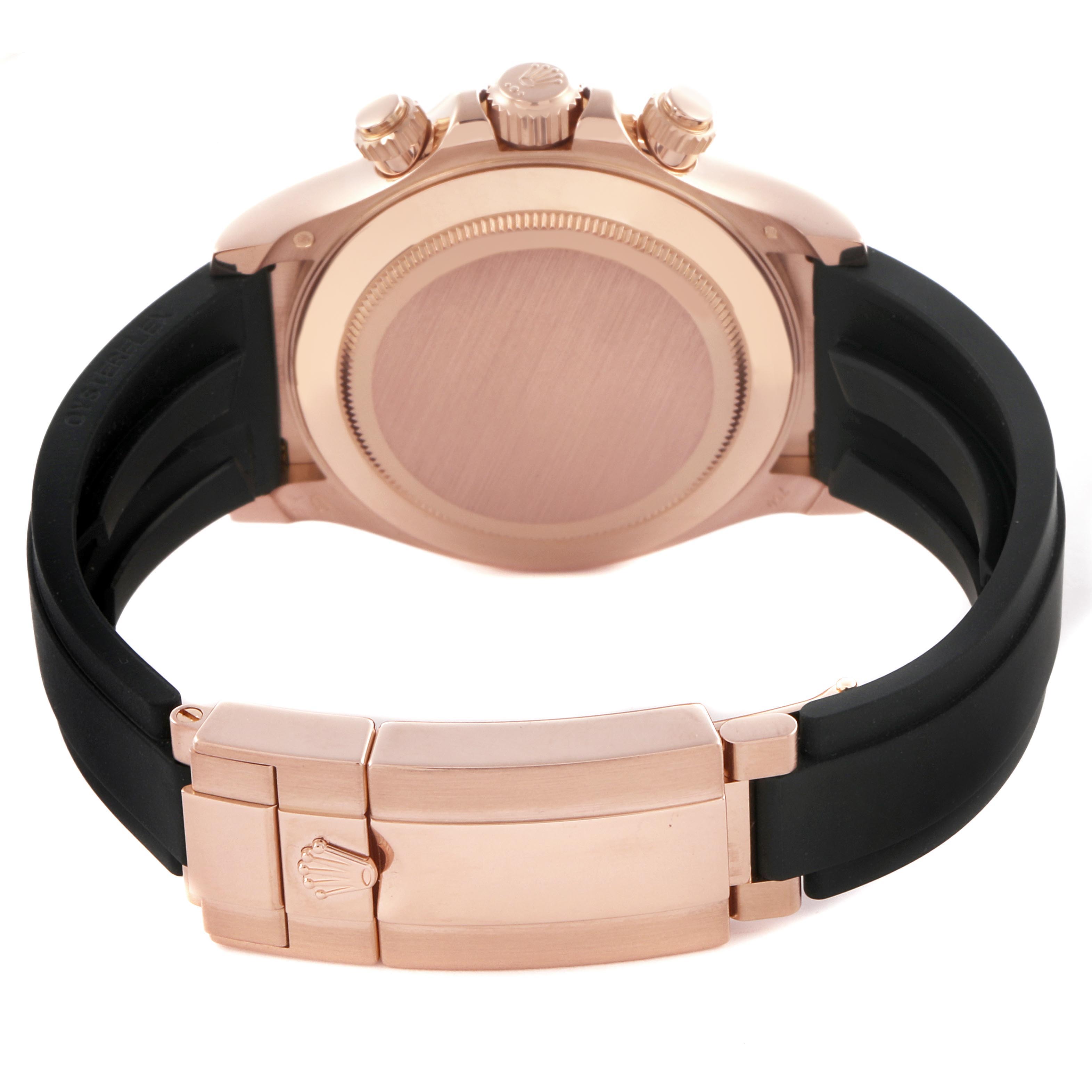 The image shows the back view of a Rolex Daytona 116515LN Men's Rose Gold Pink Dial 116515LN Men's Rose Gold Pink Dial watch, highlighting its clasp, crown, pushers, and strap.