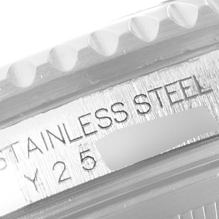 This image shows the side view of the Rolex GMT-Master 16710 Men's Stainless Steel Black Dial 16710 Men's Stainless Steel Black Dial model, highlighting the serial number and reference to "STAINLESS STEEL."